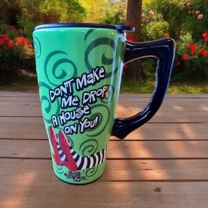Wizard of Oz Ceramic Travel Mug "Don’t Make Me Drop A House On You"